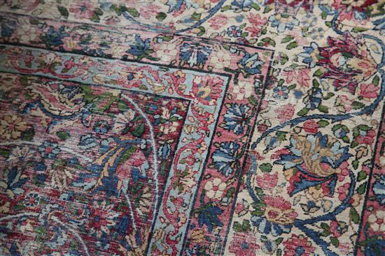 A Kirman ivory ground carpet,